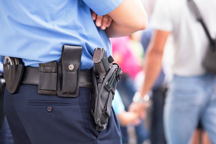 armed security guard standing watch